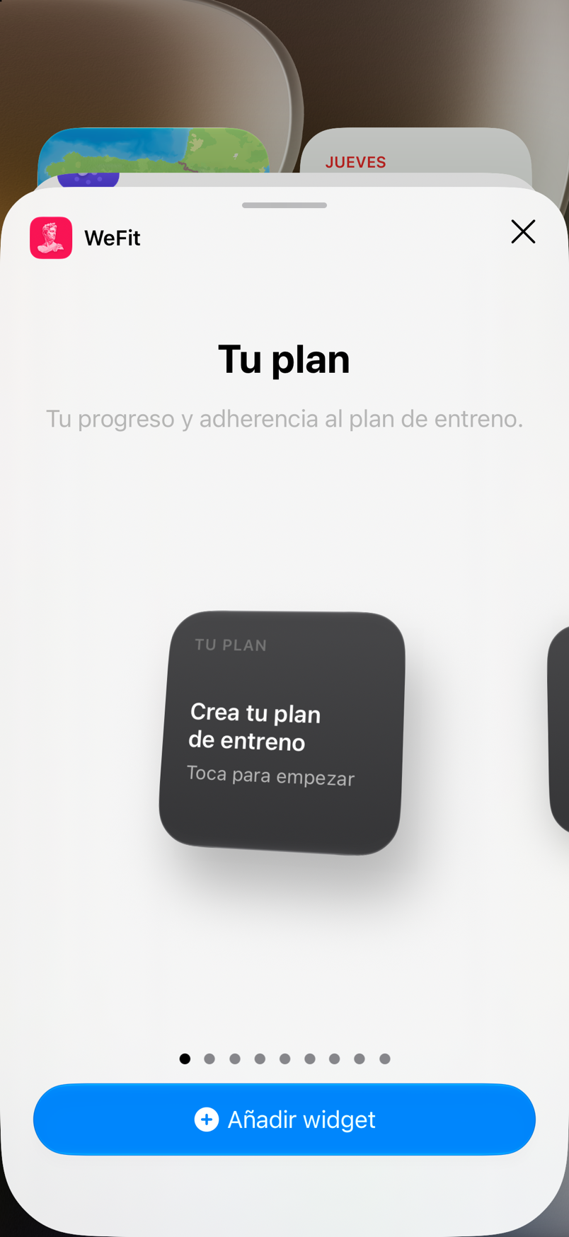 Galería de widgets de iOS en la página de WeFit: Tu plan en tamaño pequeño, indicador de páginas y botón Añadir widget